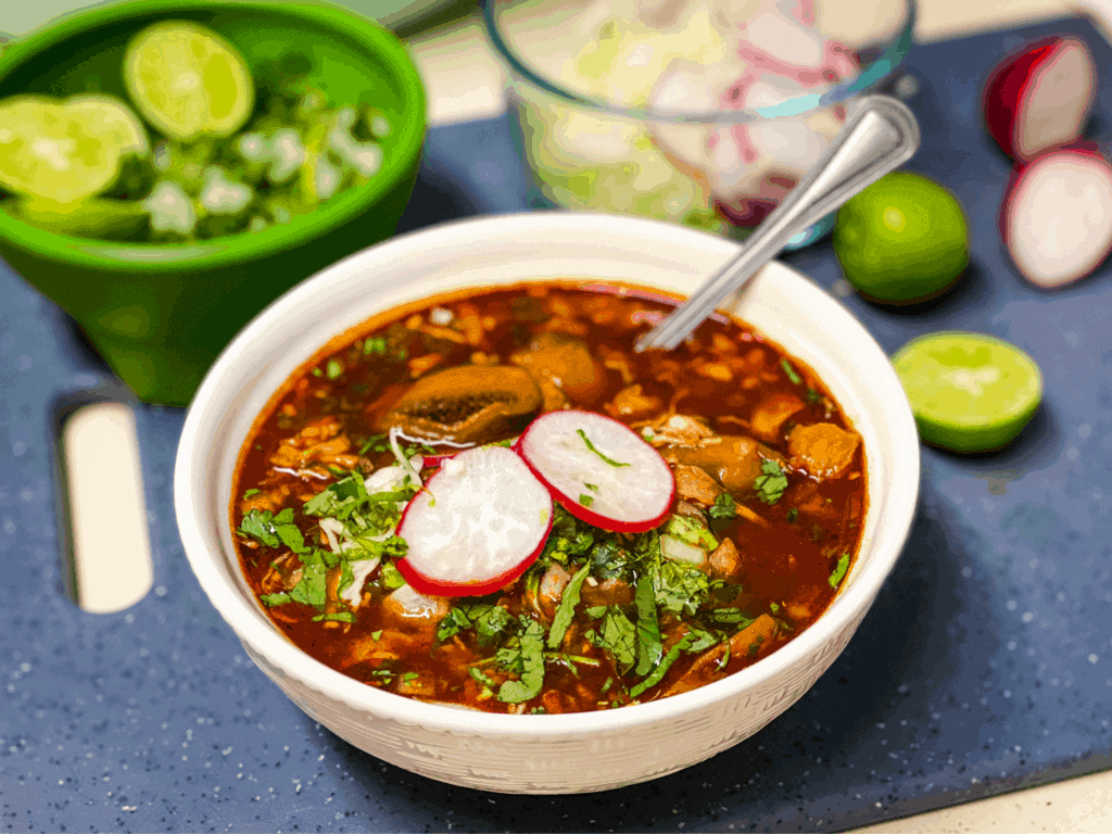 Straight view of Vegan Red Pozole/Menudo with thinly sliced raddish on top.