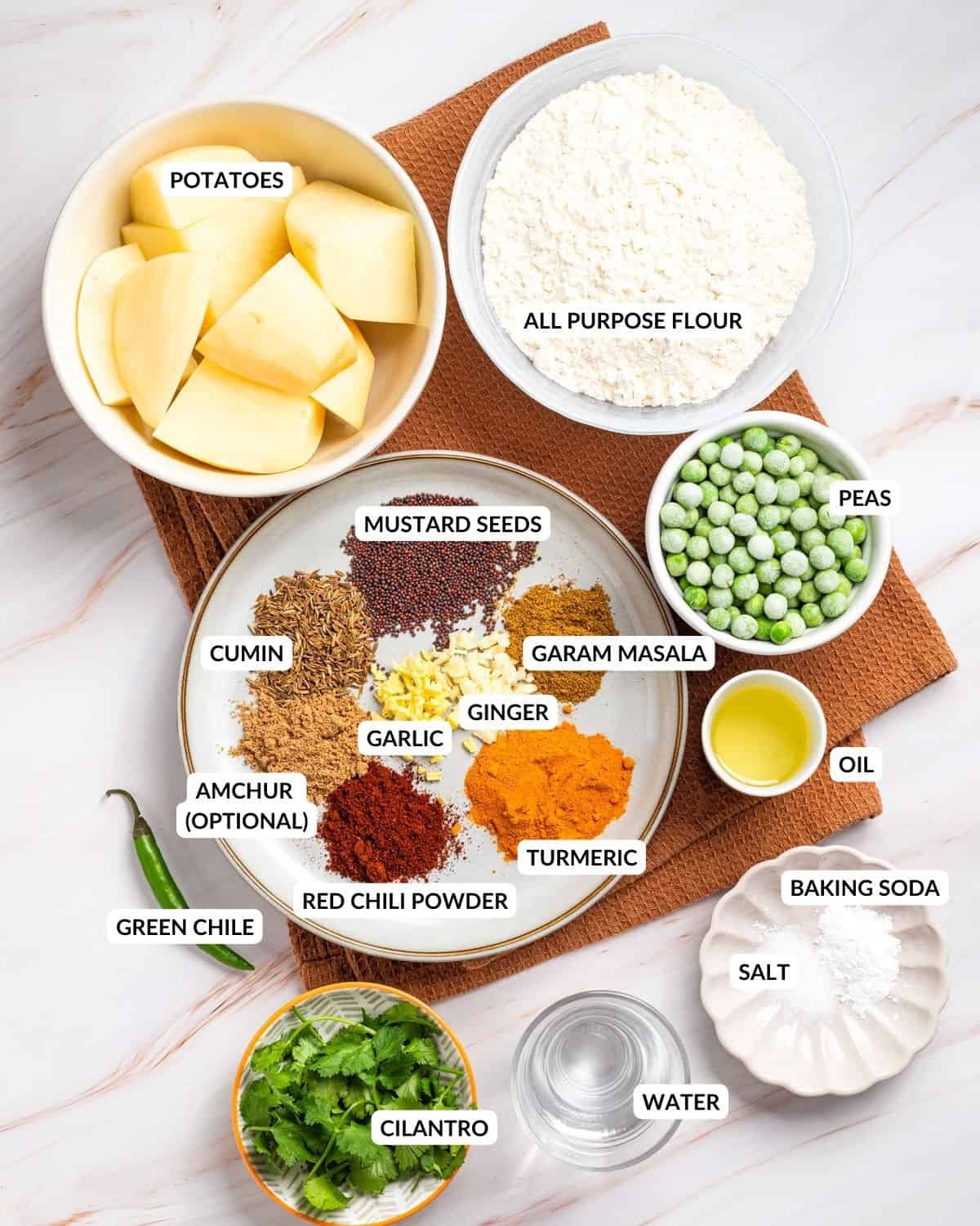 An image of all the ingredients of air fryer samosas with labels.