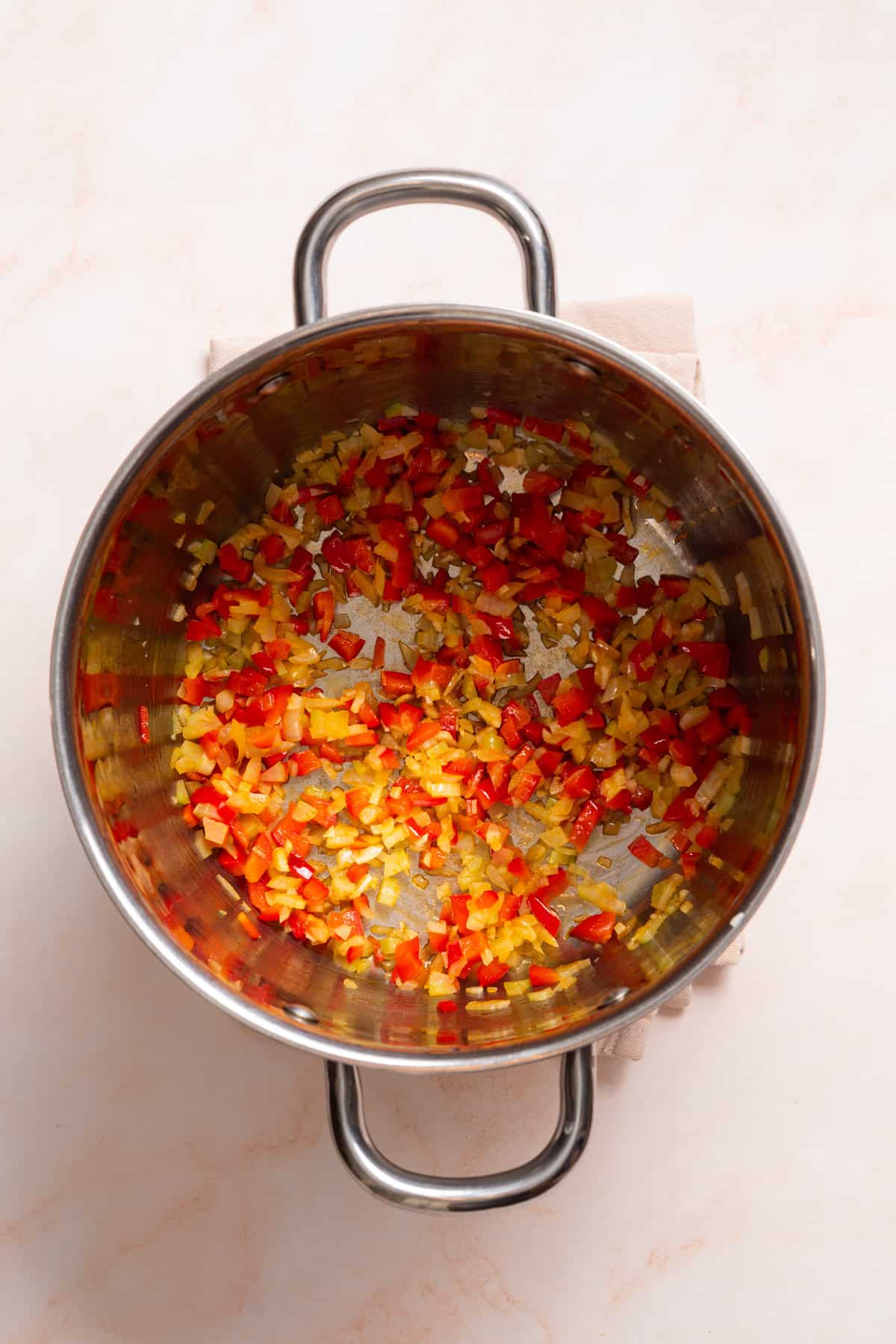 An overhead image of sauteed vegetables in a saucepan.