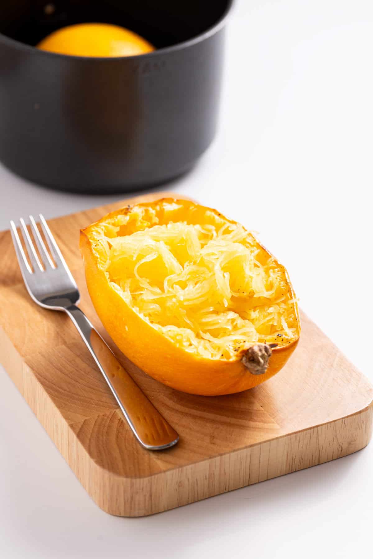 An image of spaghetti squash with the strands scraped.