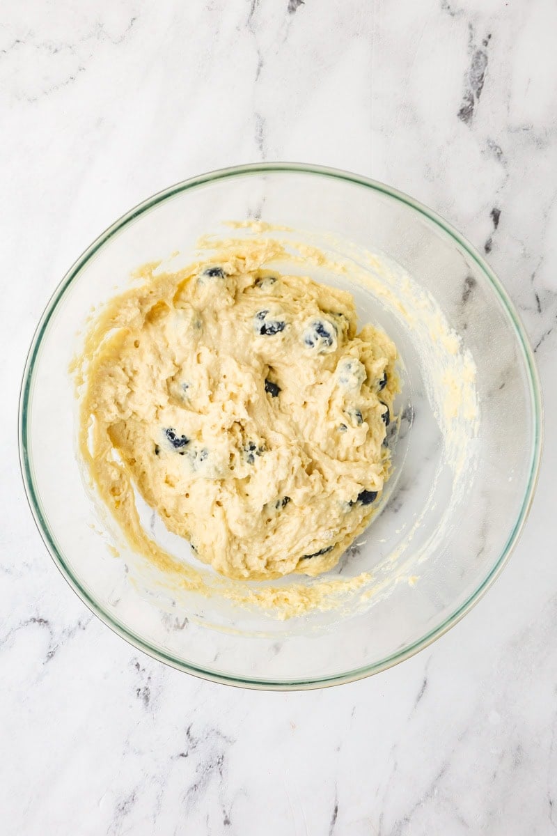 An overhead image of folding in blueberries.
