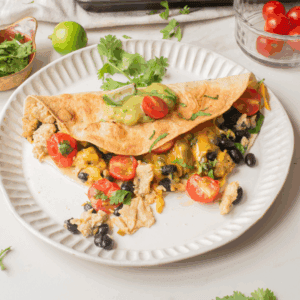 An overhead image of vegetarian breakfast quesadilla on a plate.