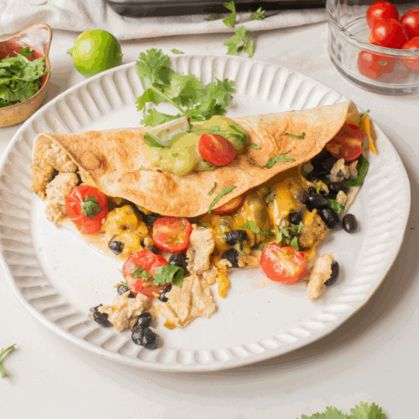 An overhead image of vegetarian breakfast quesadilla on a plate.
