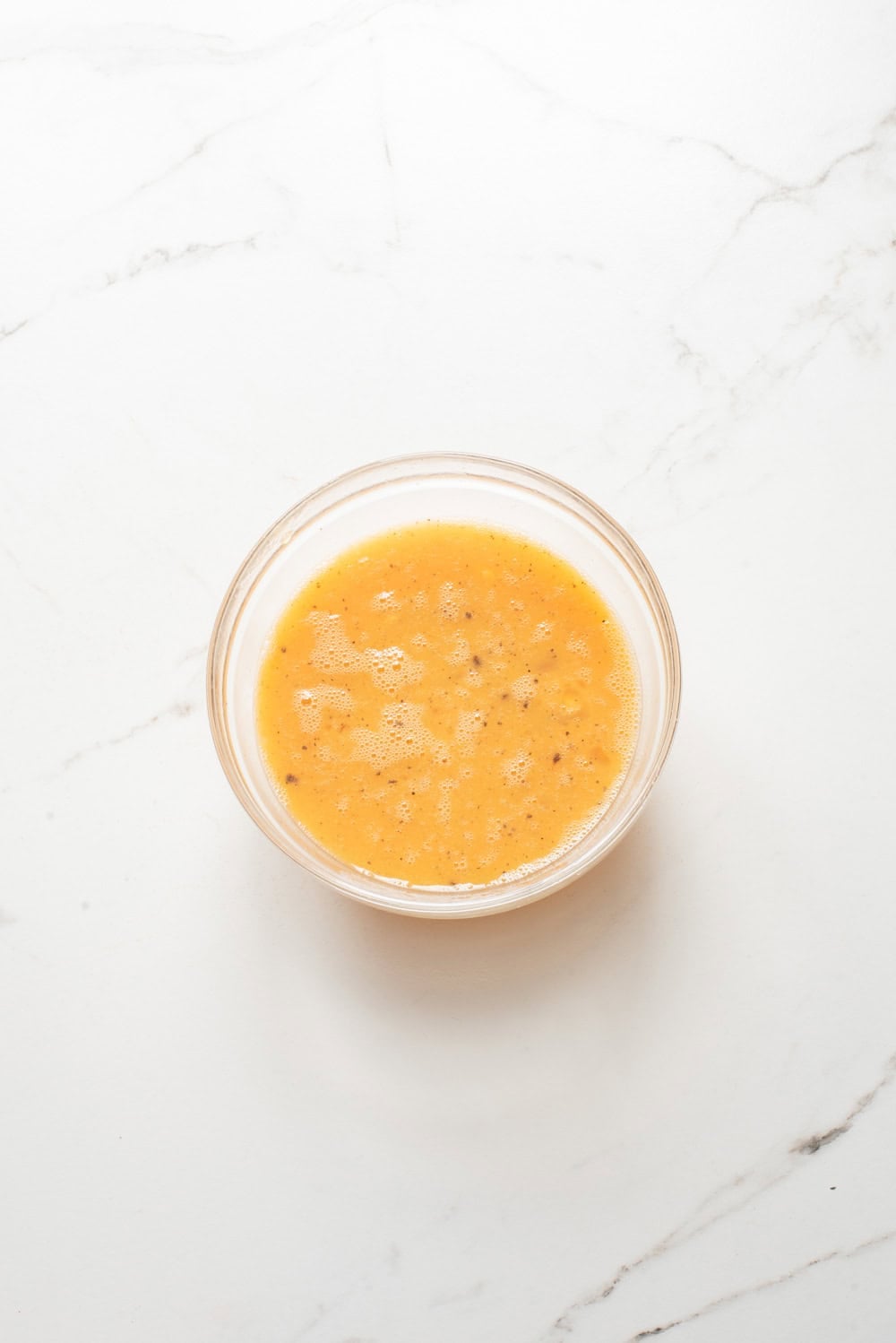 An overhead image of whisking the eggs together.