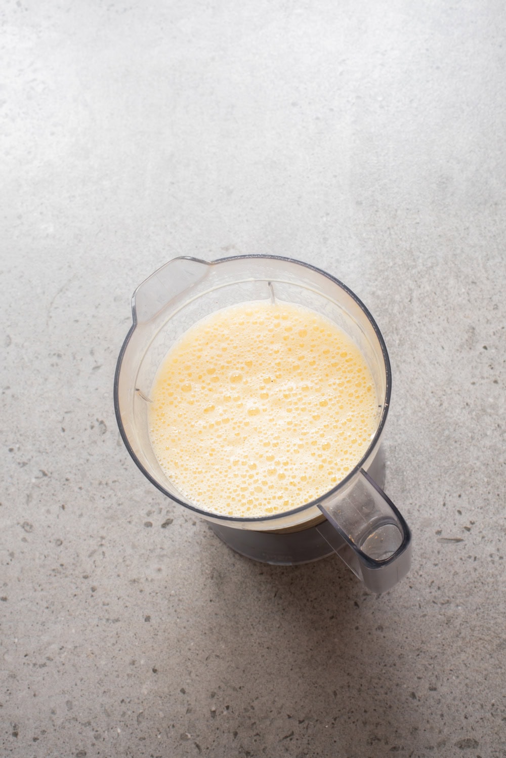 An overhead image of blending the mixture together.