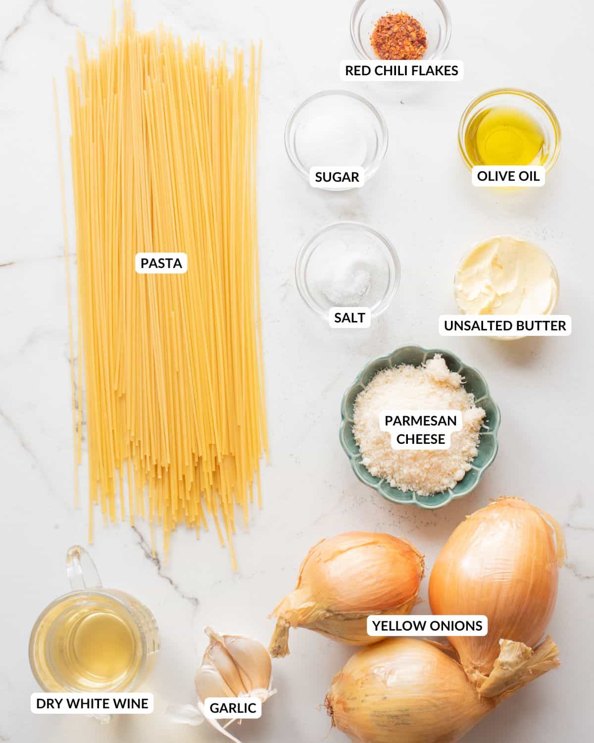 An overhead image of the ingredients of caramelized onion pasta.