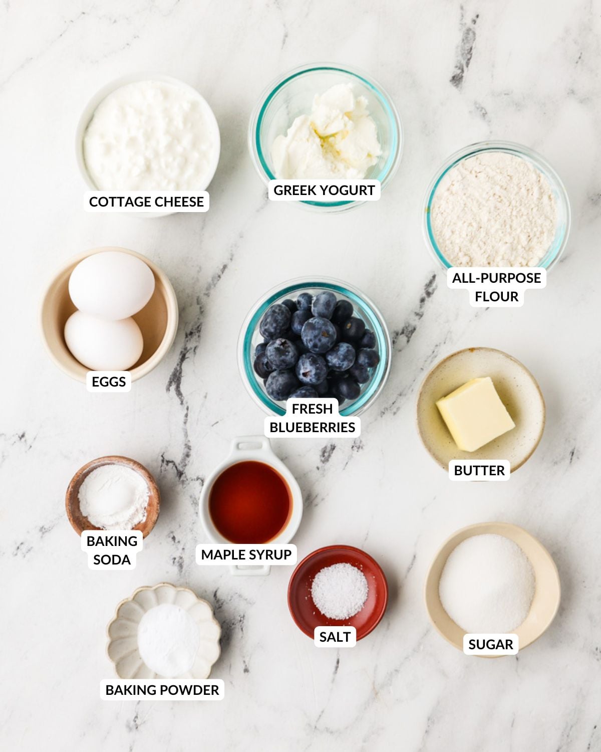 An overhead image of the ingredients of cottage cheese blueberry pancakes.