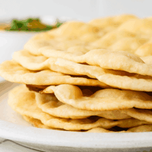 A close up image of a stack of cottage cheese flatbread.