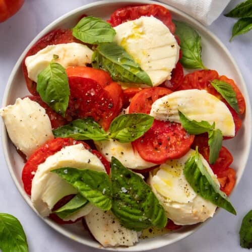 Plate with caprese salad in the center