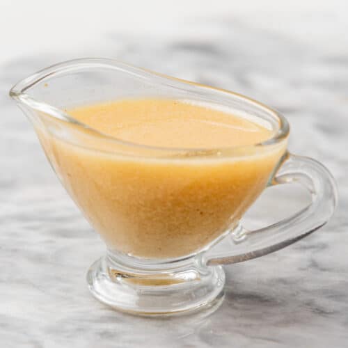 An image of champagne vinaigrette in a clear serving bowl.