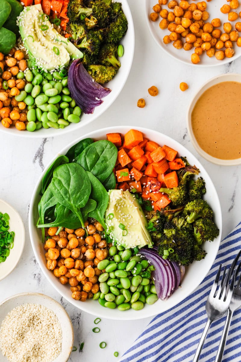 An overhead image of assembling the salad in a bowl.
