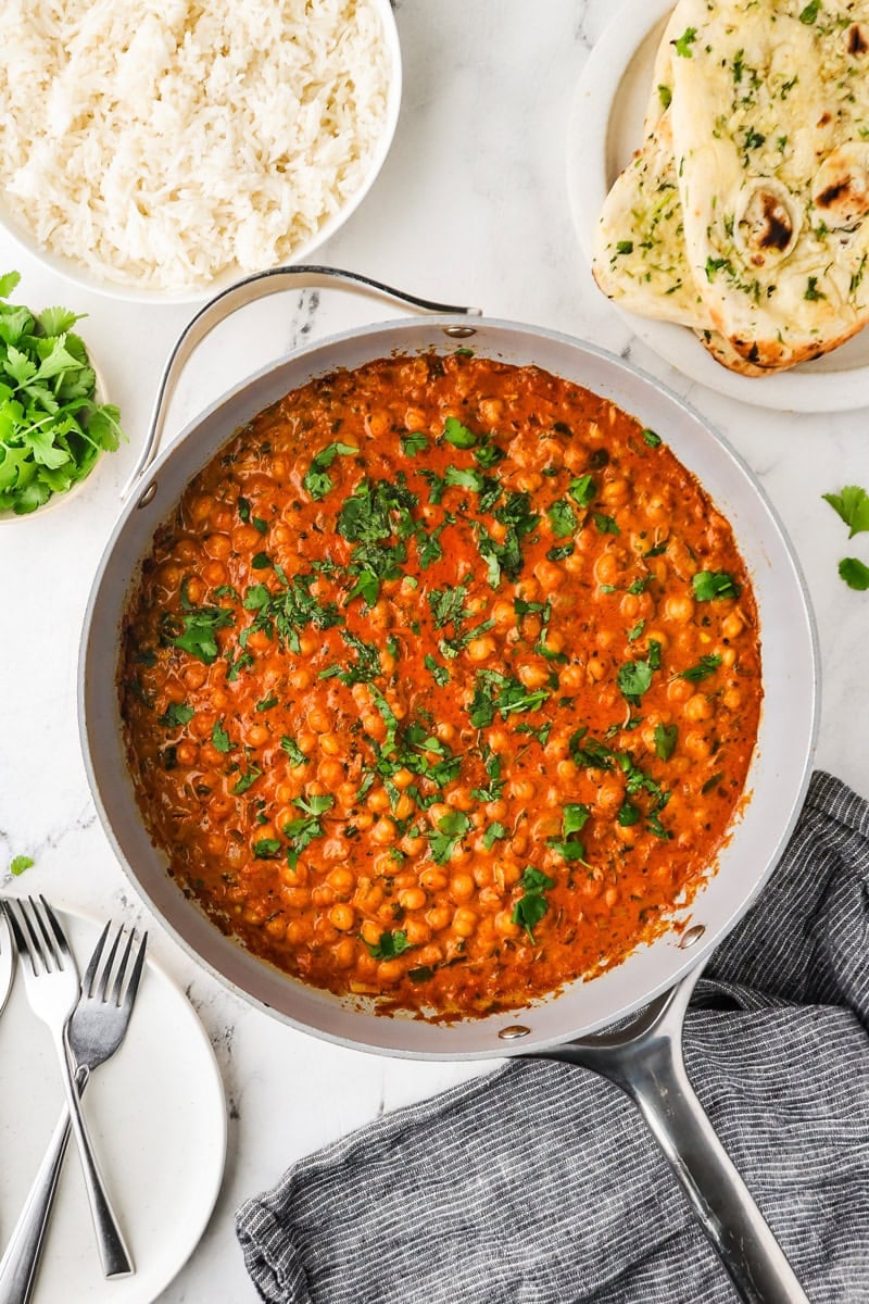 An overhead image of the chickpea tikka masala served in a skillet.