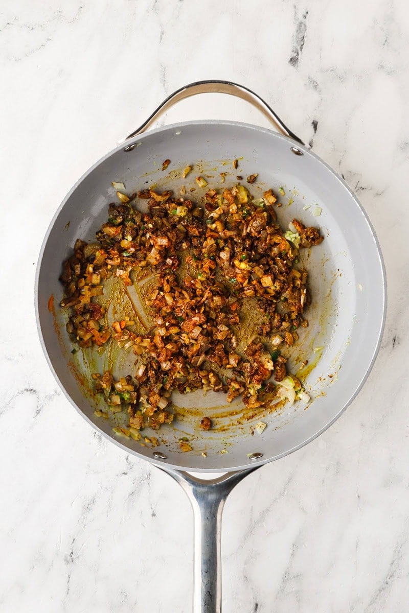 An overhead image of adding the spices.