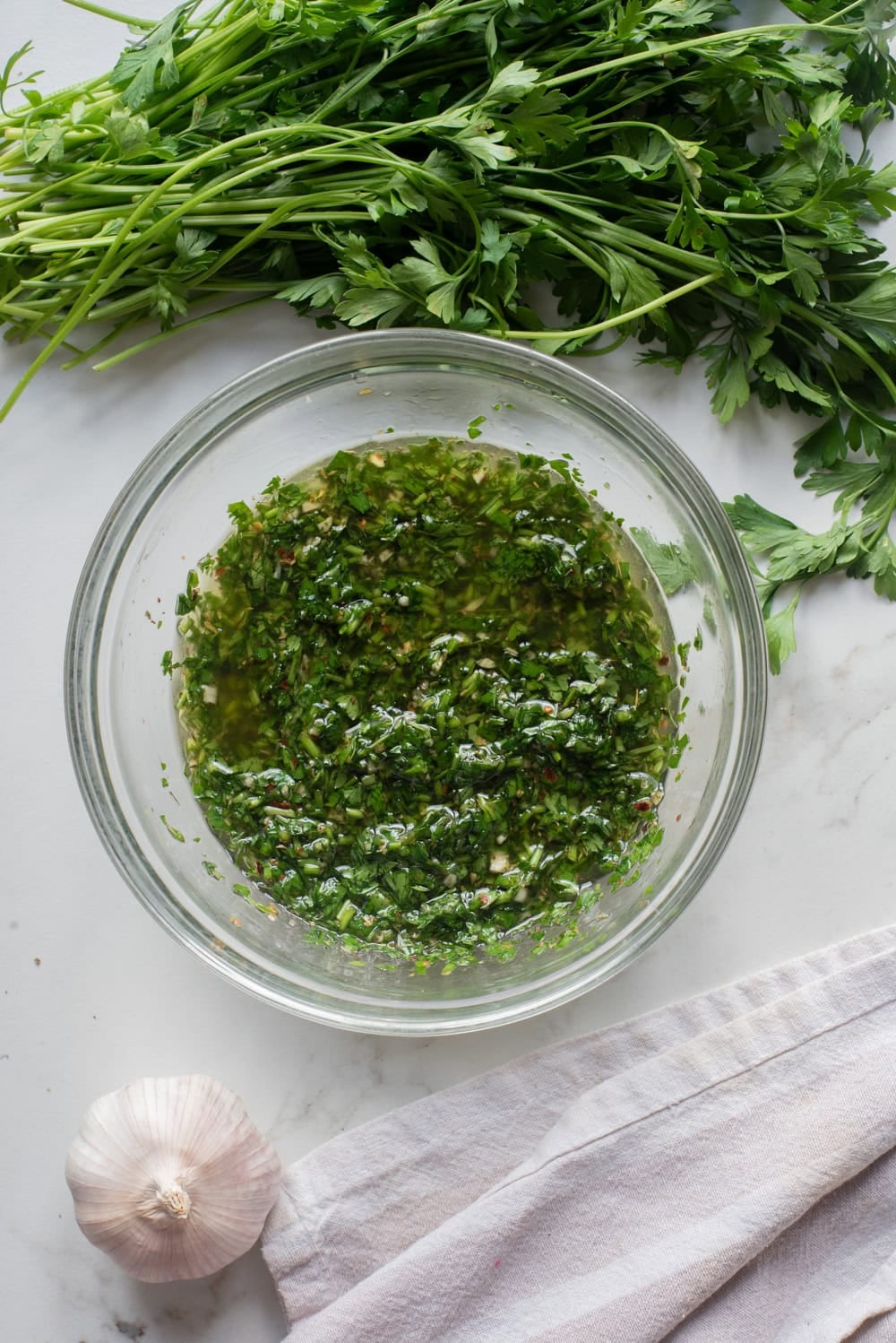 Chimichurri sauce mixed with olive oil and red wine vinegar until loose and glossy.