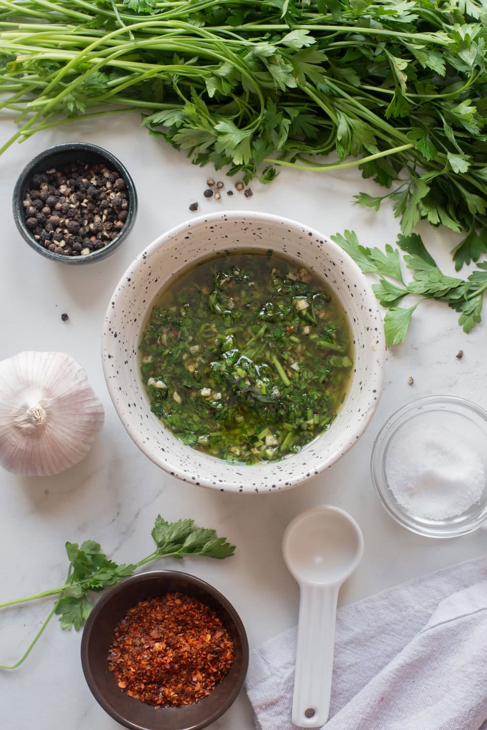 Finished homemade chimichurri sauce in a serving bowl ready to serve.