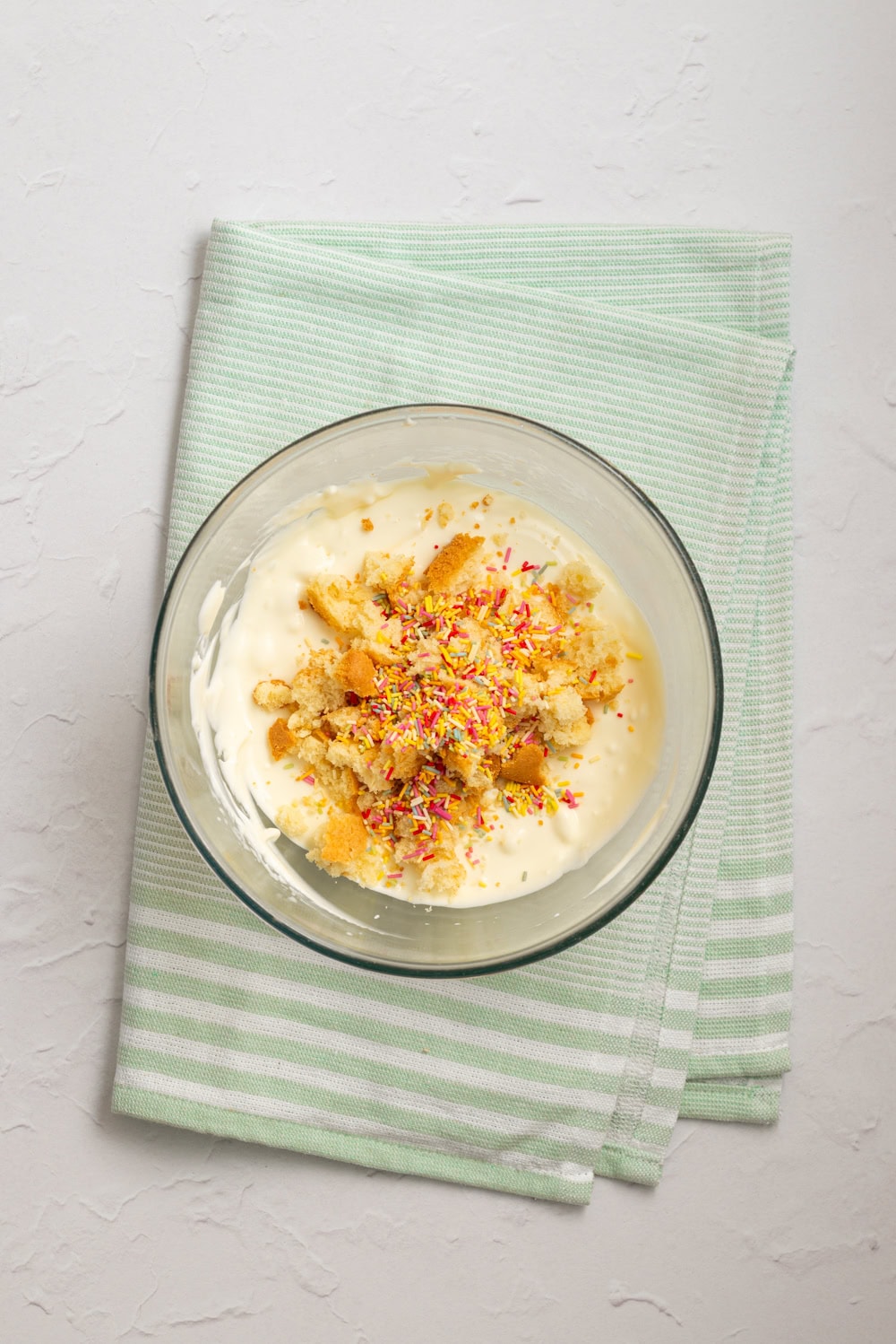 Rainbow sprinkles and crumbled cake folded into the dip.