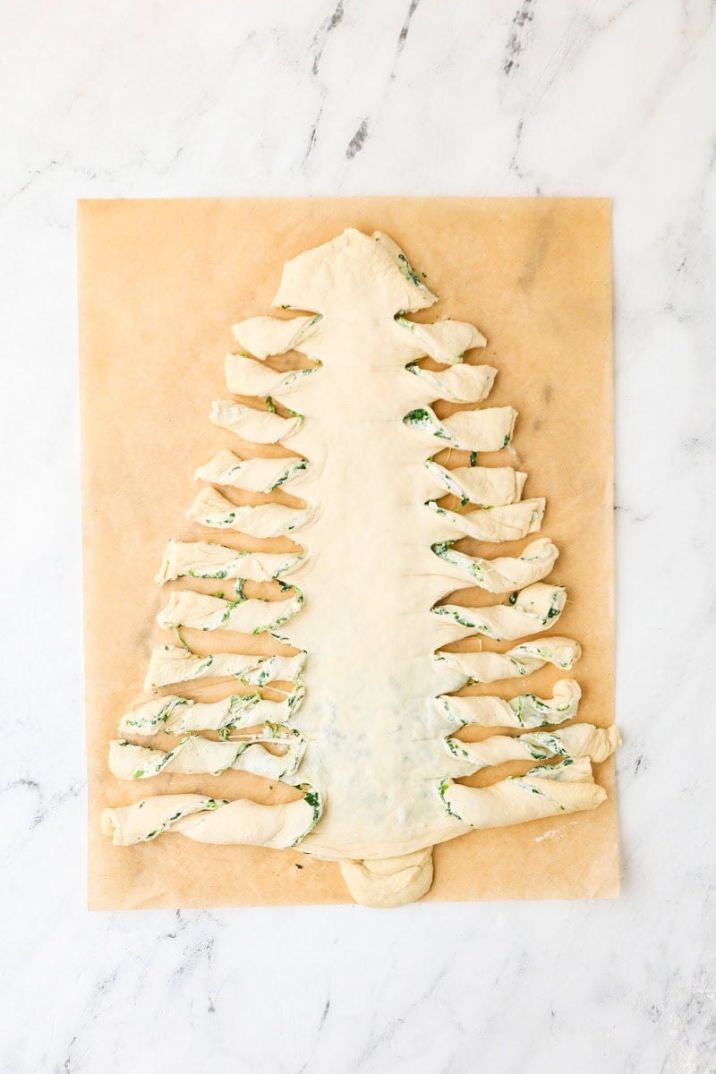 Filled Christmas tree dough cut into strips and twisted into branches.