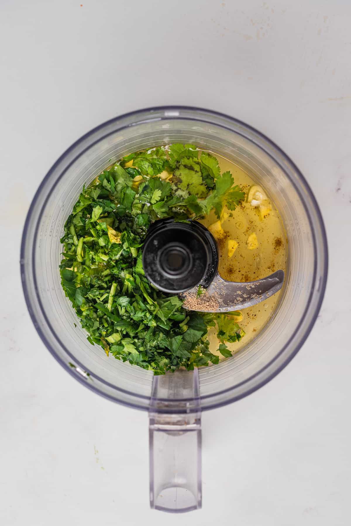 An overhead image of the ingredients of cilantro lime dressing before blending in a blender.