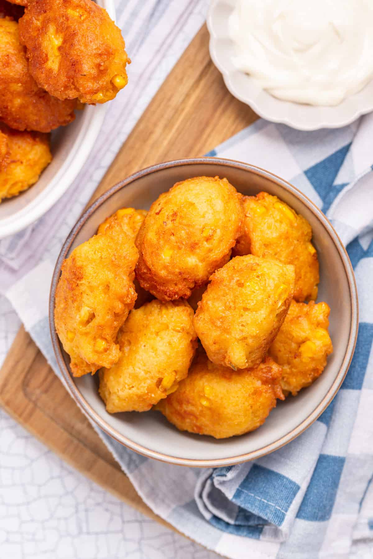 An overhead image of corn nuggets in a bowl.