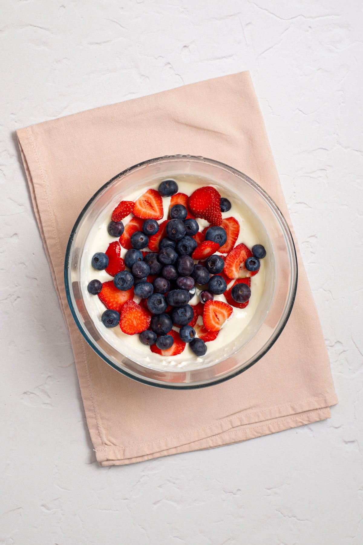 Fresh strawberries and blueberries folded into the cottage cheese mixture before freezing.