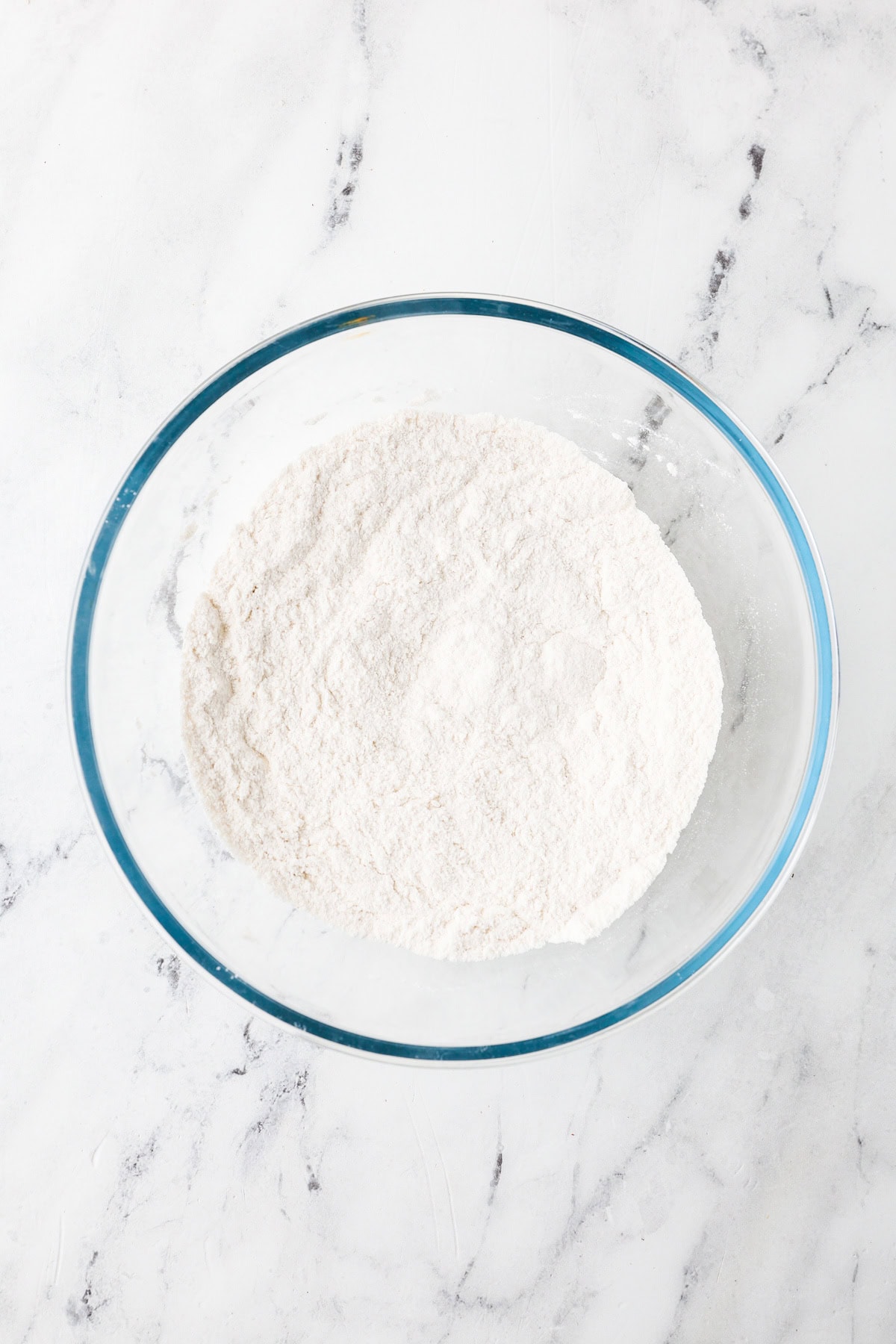 An overhead image of combining the dry ingredient mixture together in a bowl.