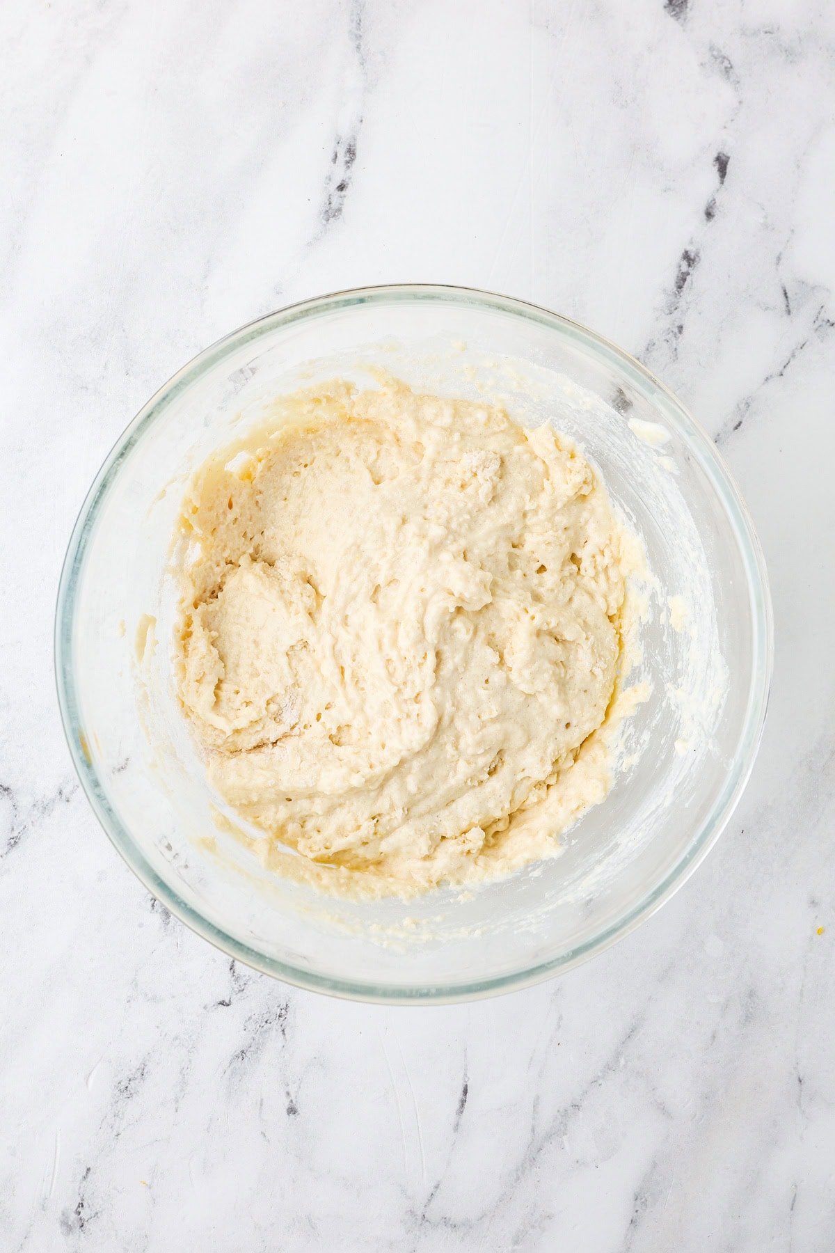 An overhead image of combining the wet and dry ingredient mixture in a bowl.
