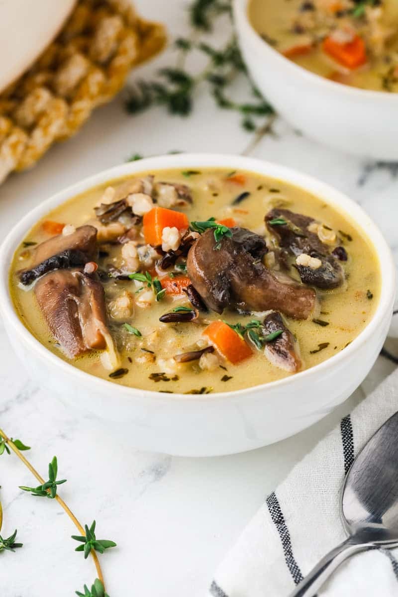 A close up image of creamy wild rice soup in a bowl.