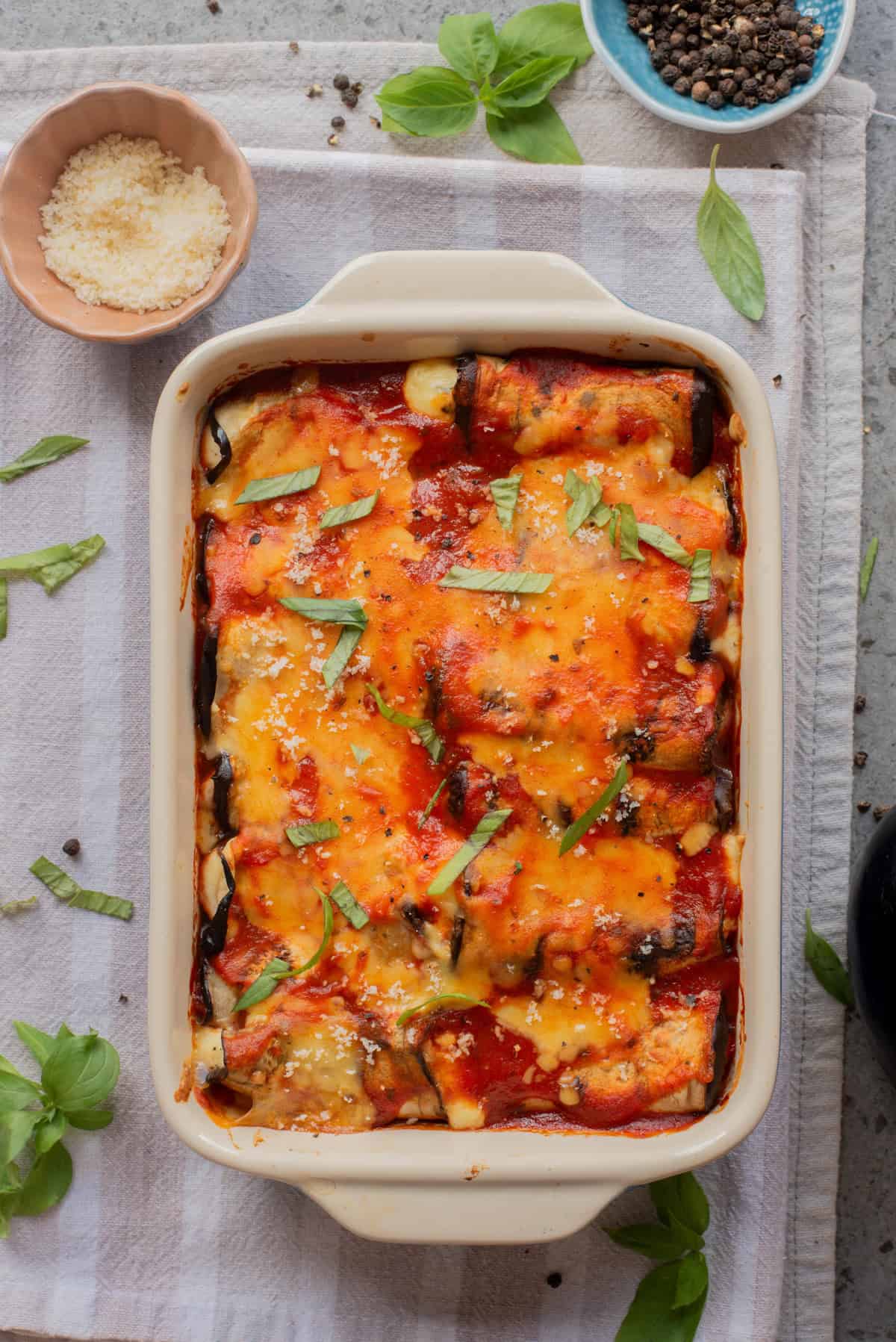 An overhead image of cooked eggplant rollatini.