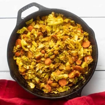 Fresh off the stove, Ethiopian cabbage in cast iron skillet