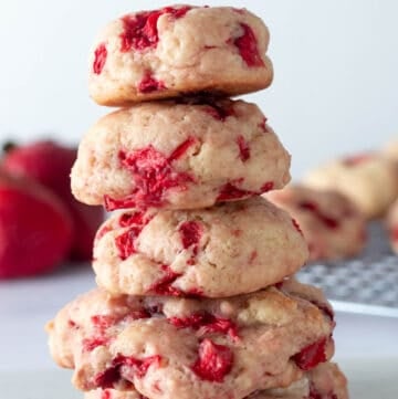 Strawberry cookies, fresh from the oven, stacked on top of each other to show fluffiness
