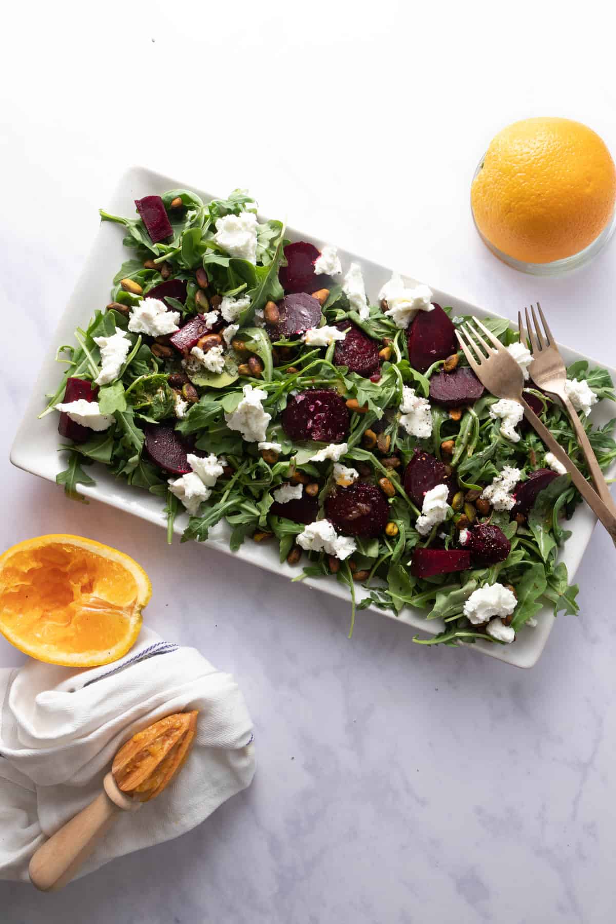Platter with roasted beets, arugula, goat cheese and pistachios