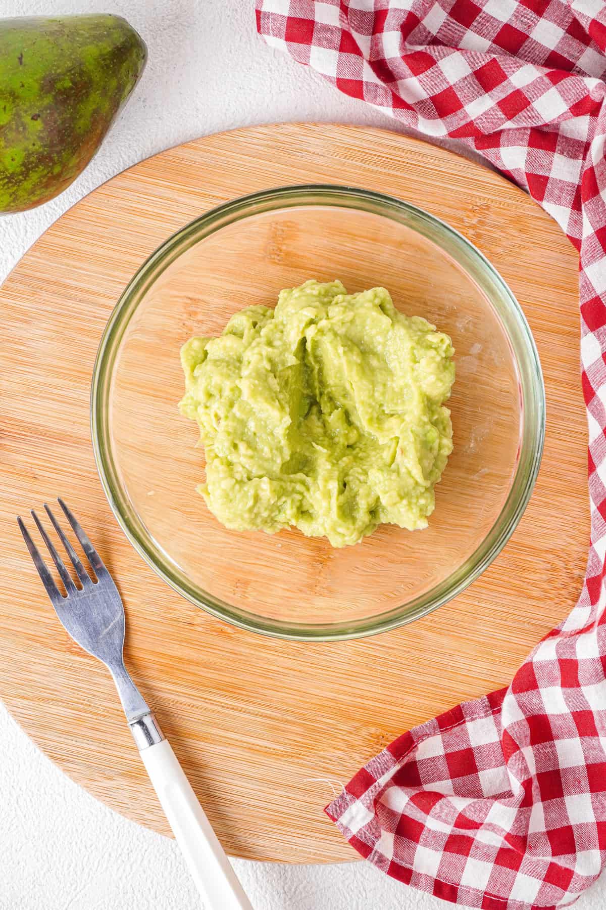 Overhead view of mashed avocados