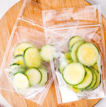An image of sliced zucchini frozen in a freezer bag