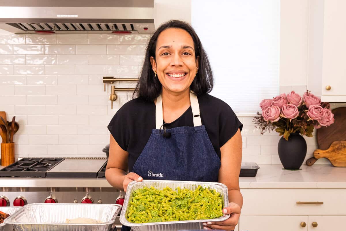 Shruthi with green goddess pasta bake in a freezer-prepped bag.