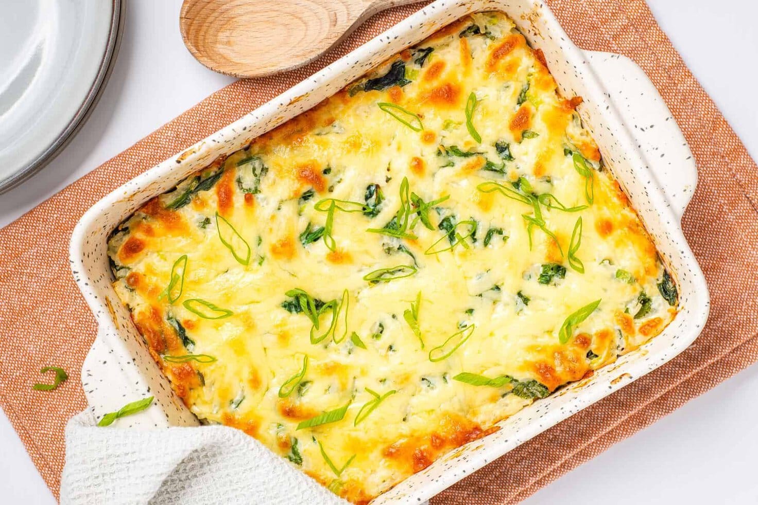 Horizontal image of freshly baked cheesy rice casserole.