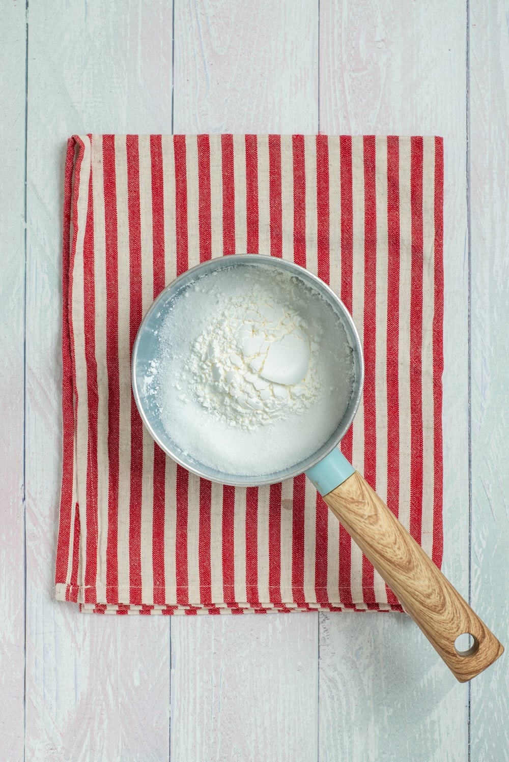 Cornstarch mixture in a saucepan for the homemade green pudding.