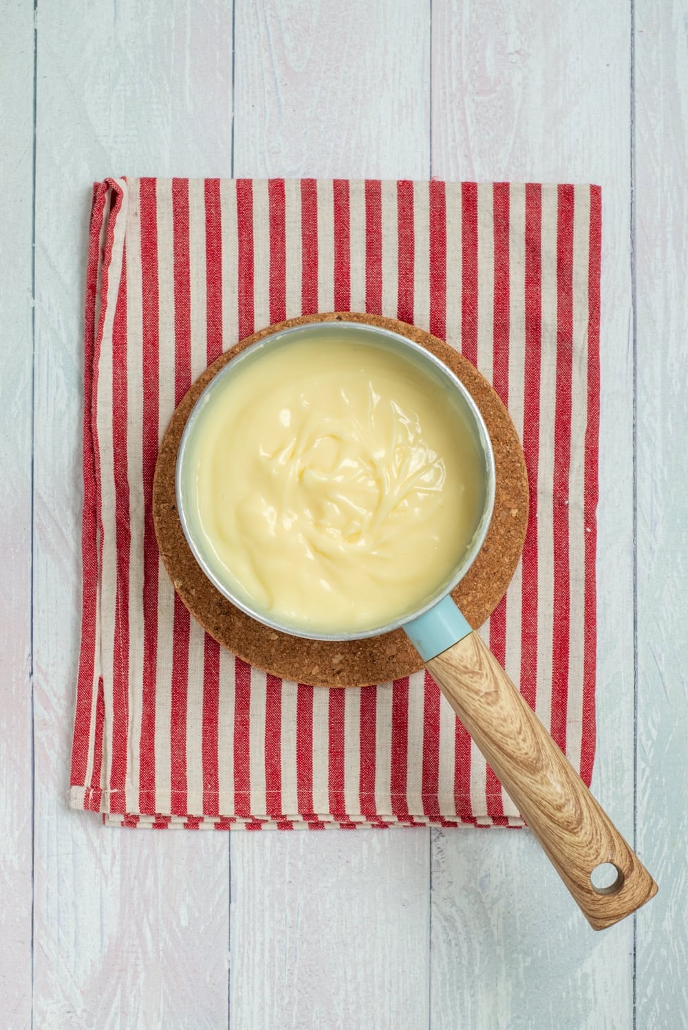 Thickened pudding cooking in a saucepan for Grinch Who Pudding.