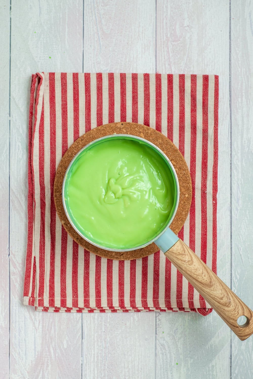 Smooth bright green pudding after adding green food coloring.