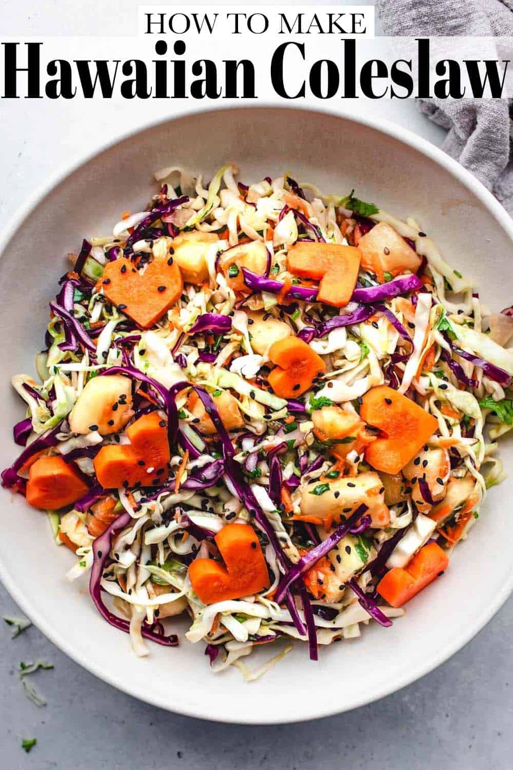 An overhead view of Hawaiian coleslaw with heart-shaped carrots on top.