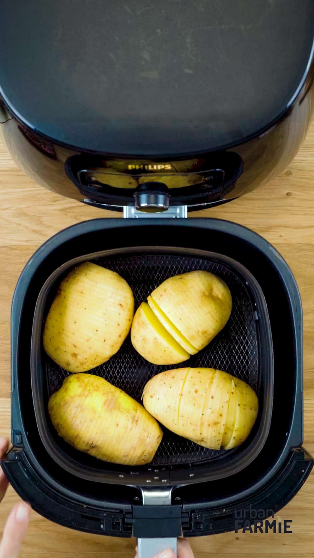 An image of slit potatoes in an airfryer.