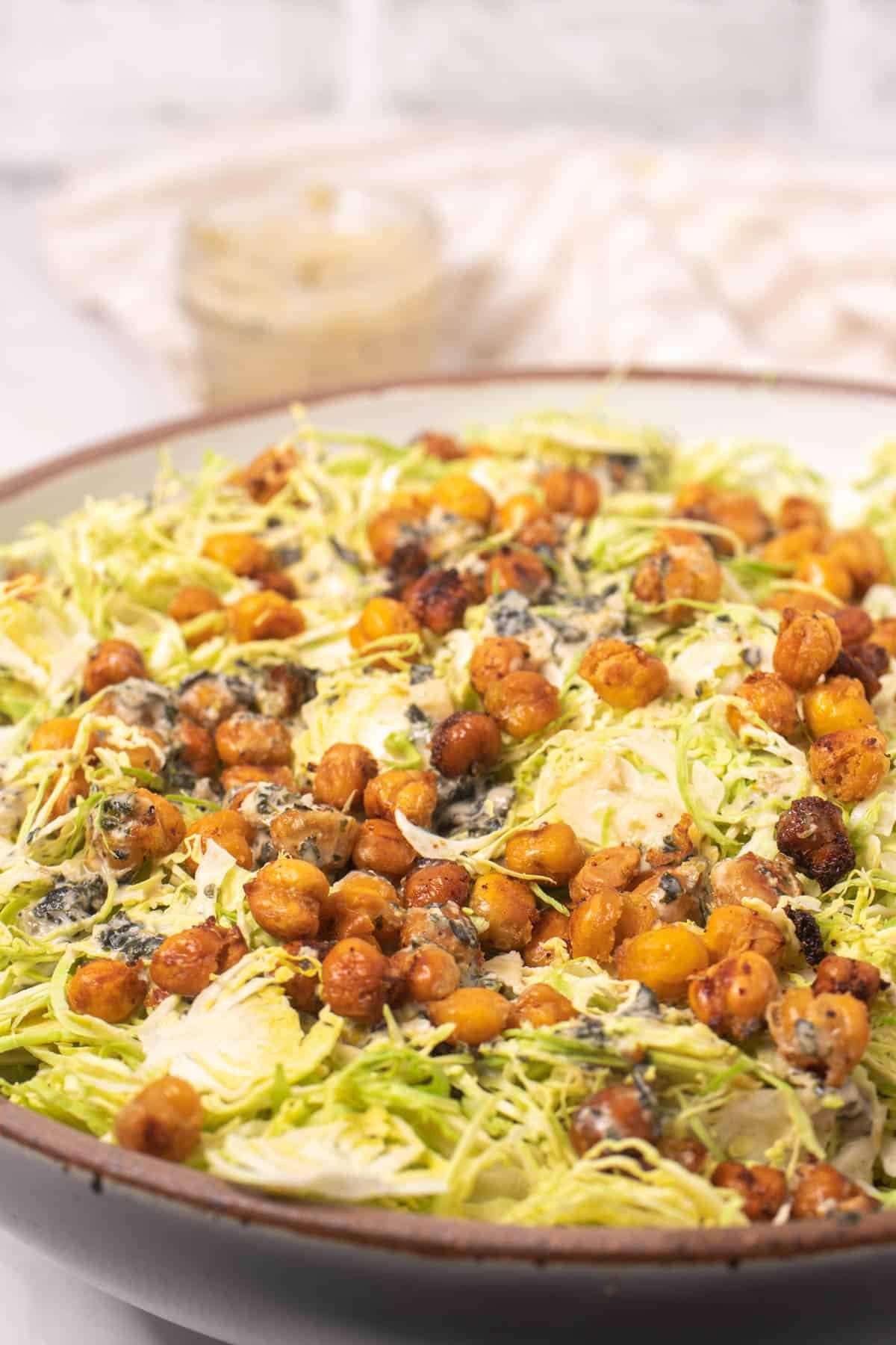 Close up of Brussels Sprouts and toasted chickpea croutons in salad bowl 