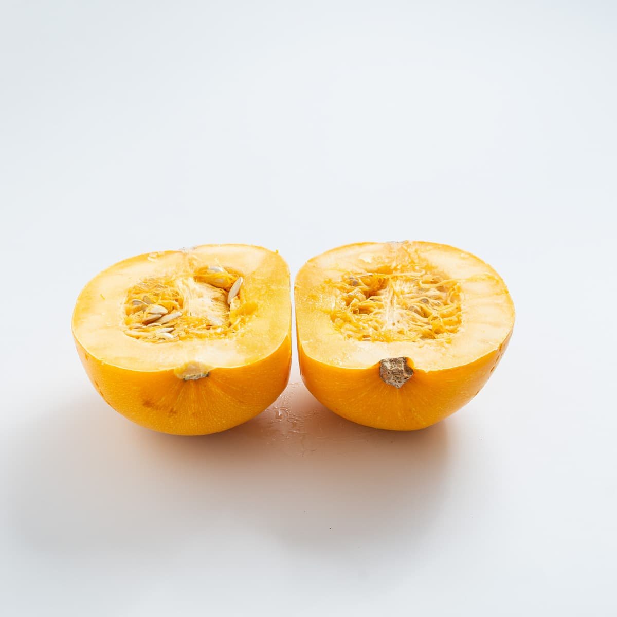 Overhead view showing the spaghetti squash cut into two halves. 