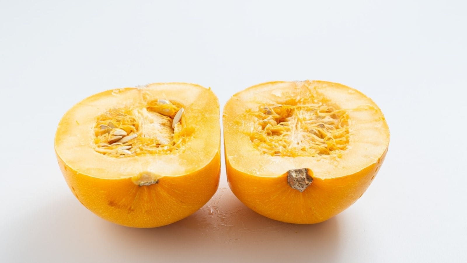 A close up view of spaghetti squash cut in half.