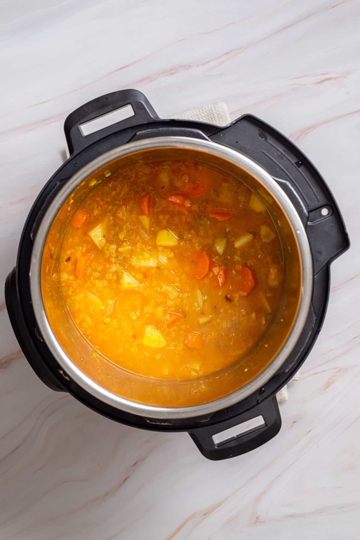 Overhead view of simmered mulligatawny soup in an instant pot.