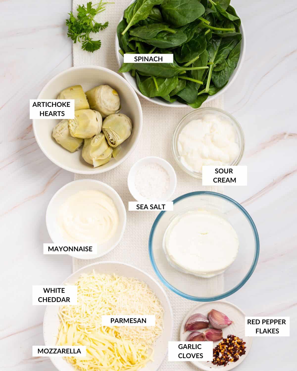 Labeled ingredients for Instant Pot Spinach and Artichoke Dip - check recipe card for details.
