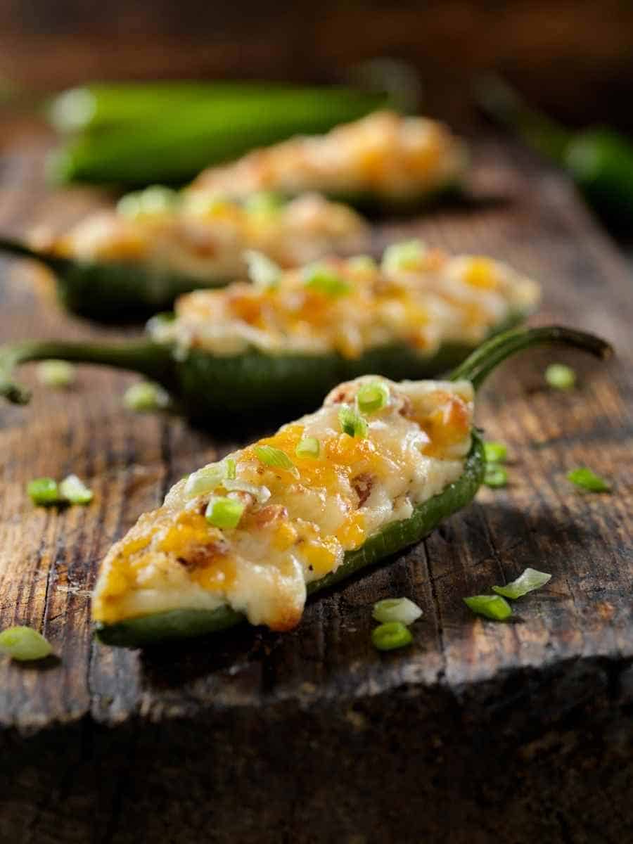 Close up of jalapeno poppers on a wooden tray