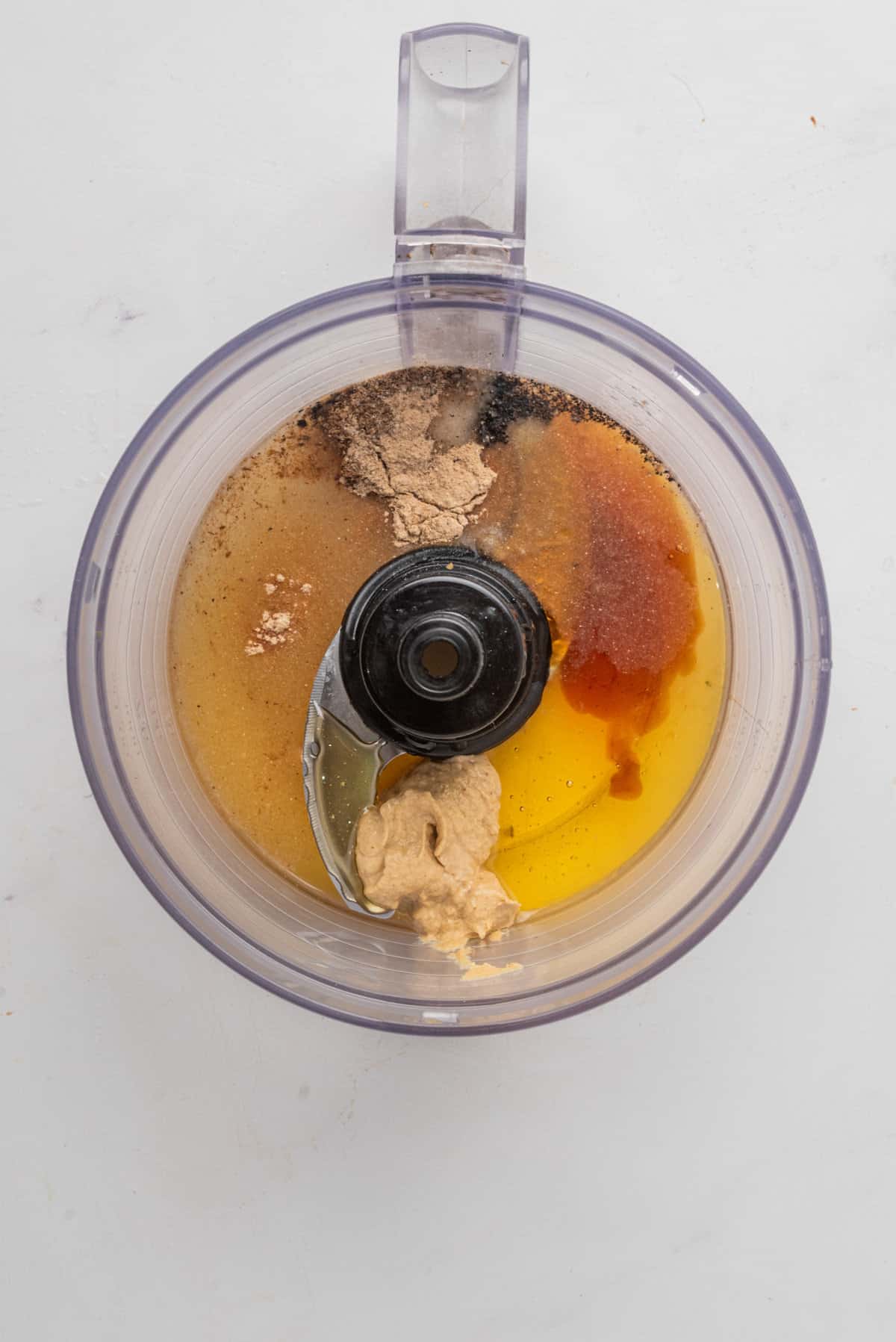 An image of the ingredients of the salad dressing in a blender.