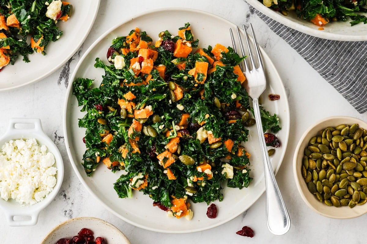 An overhead image of kale sweet potato salad on a plate.