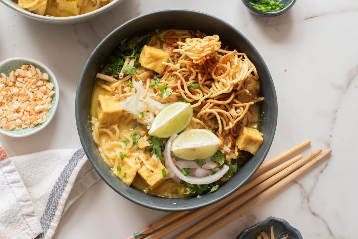 An overhead image of khao soi served in a bowl.