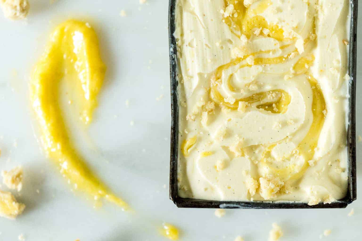 Overhead view of limoncello gelato with a vanilla lemon curd swirl.